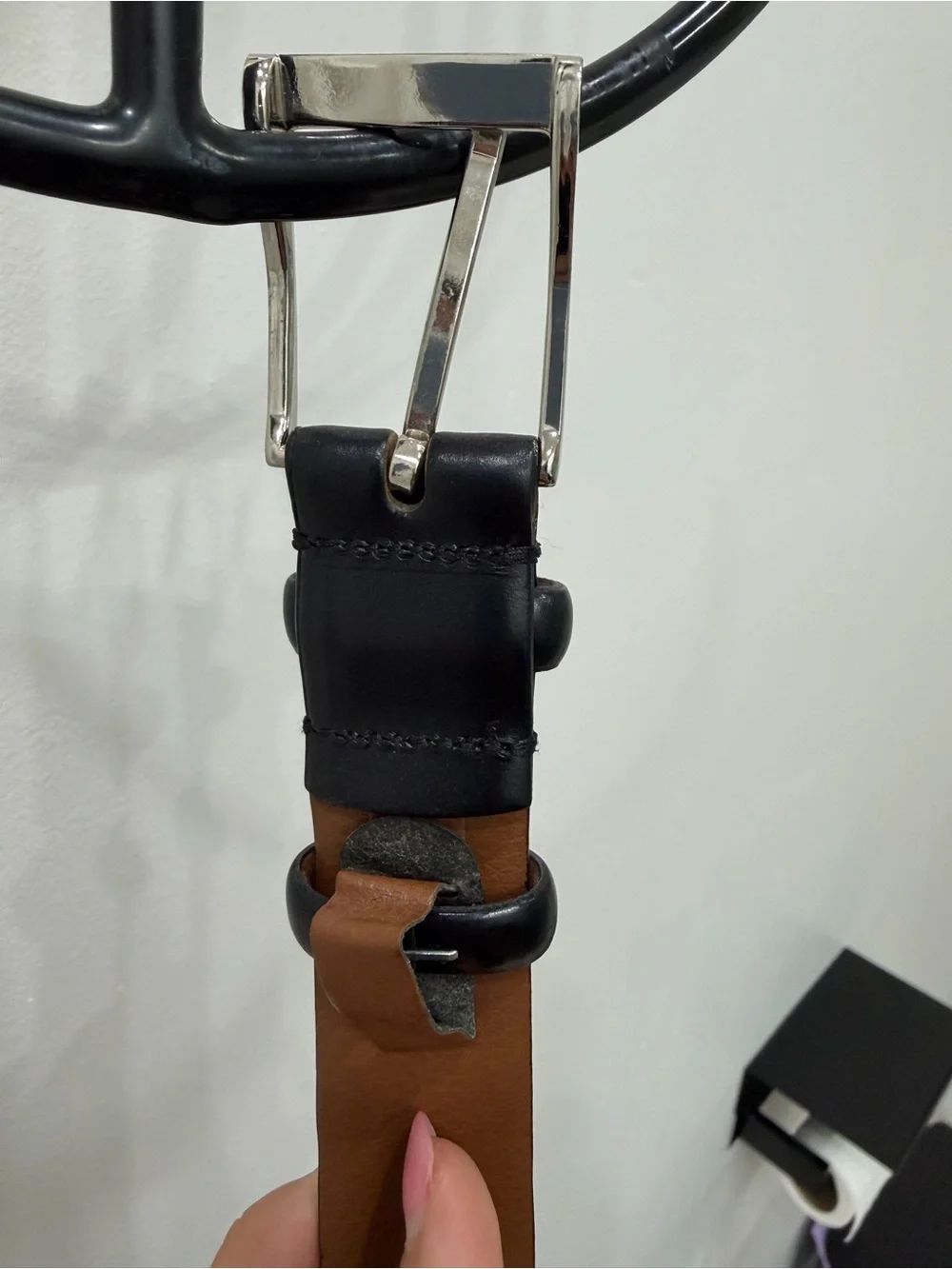 Men’s black leather belt with silver buckle
